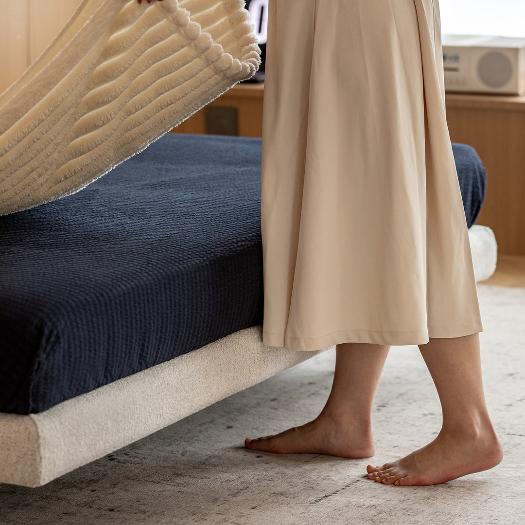 Minimalist boucle fabric bed morn in real life style.