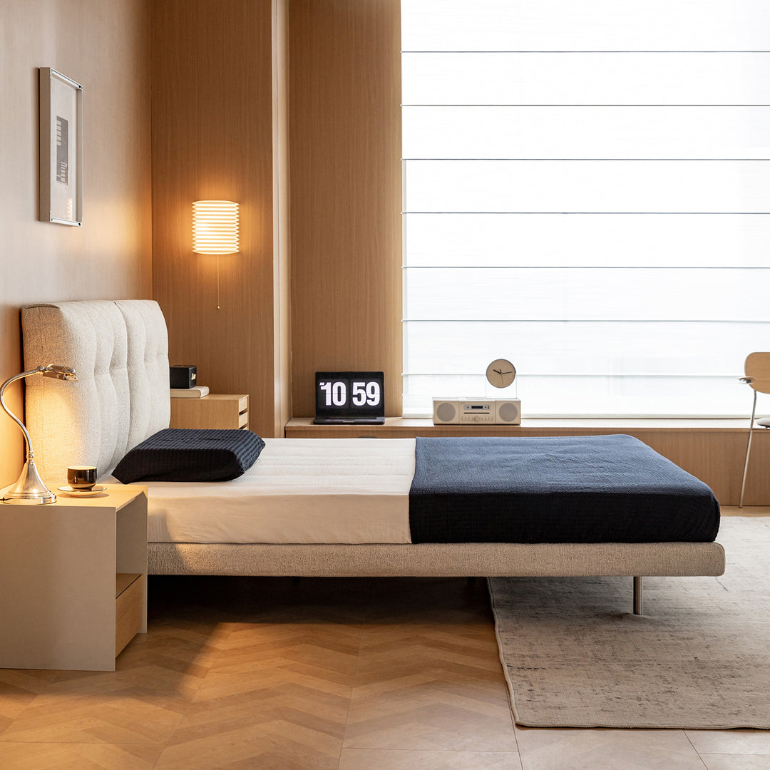 Minimalist boucle fabric bed morn with context.