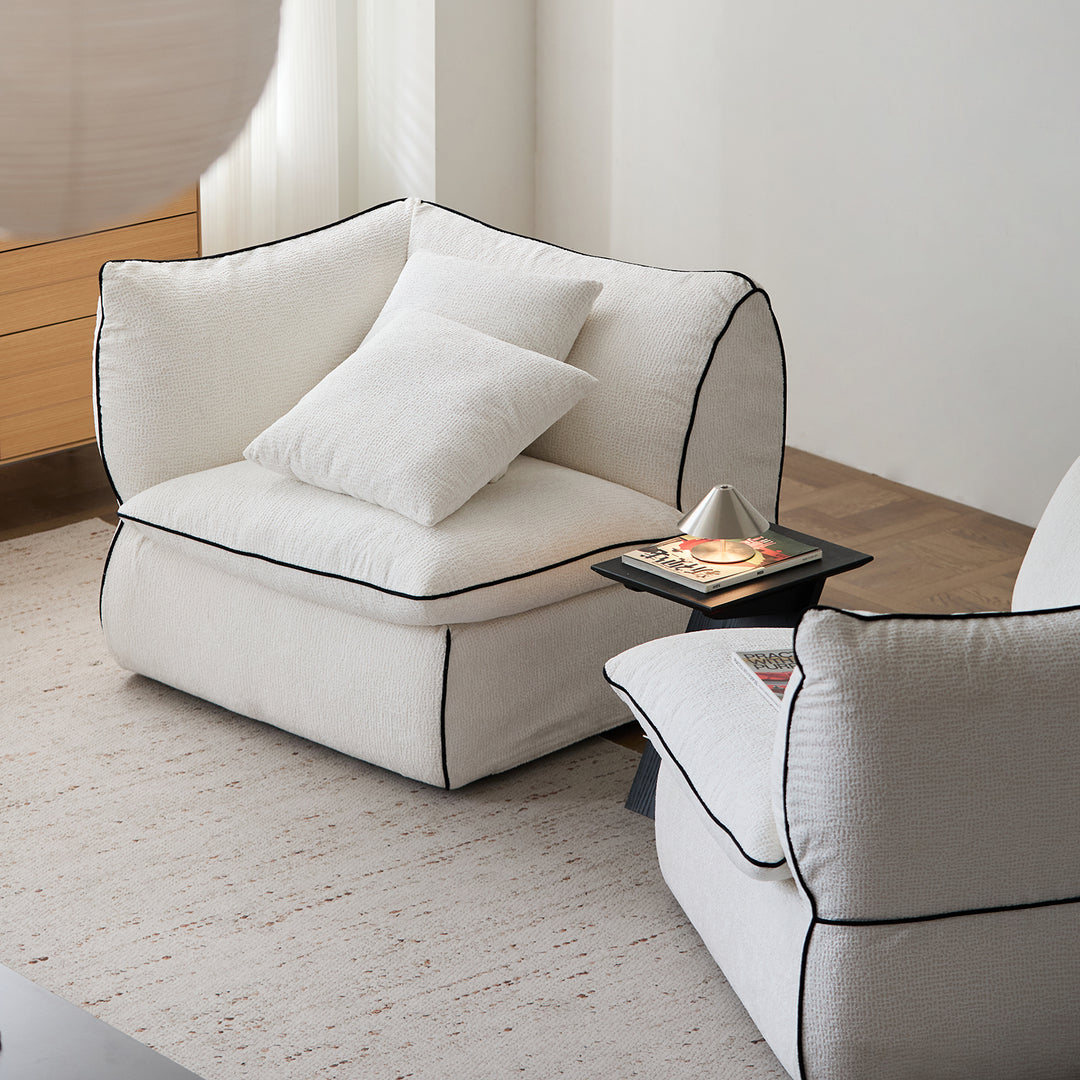 Minimalist chenille velvet fabric 4 seater sofa cloud in panoramic view.