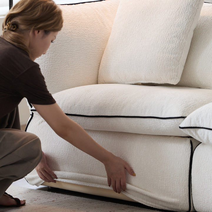 Minimalist chenille velvet fabric ottoman cloud in close up details.