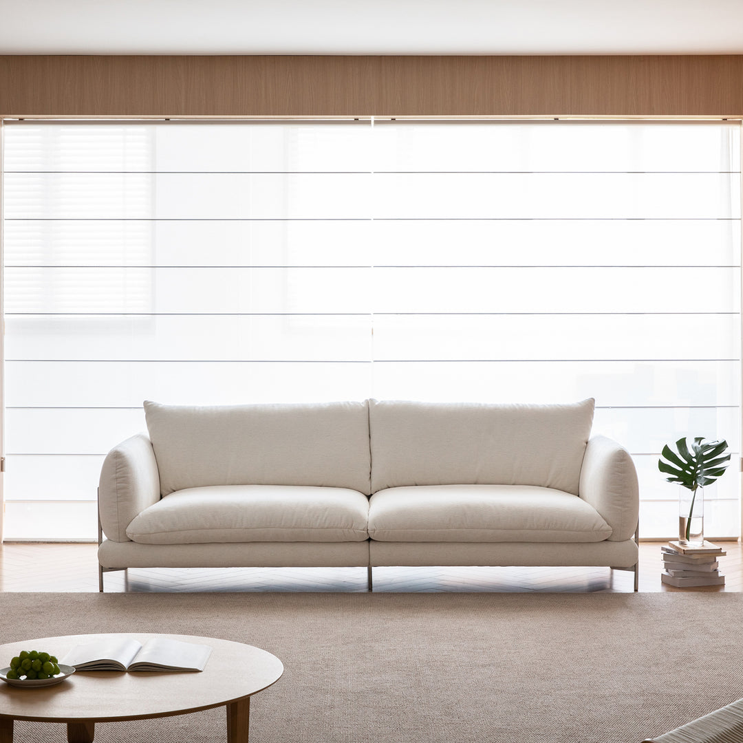 Minimalist cotton fabric 4 seater sofa como in real life style.