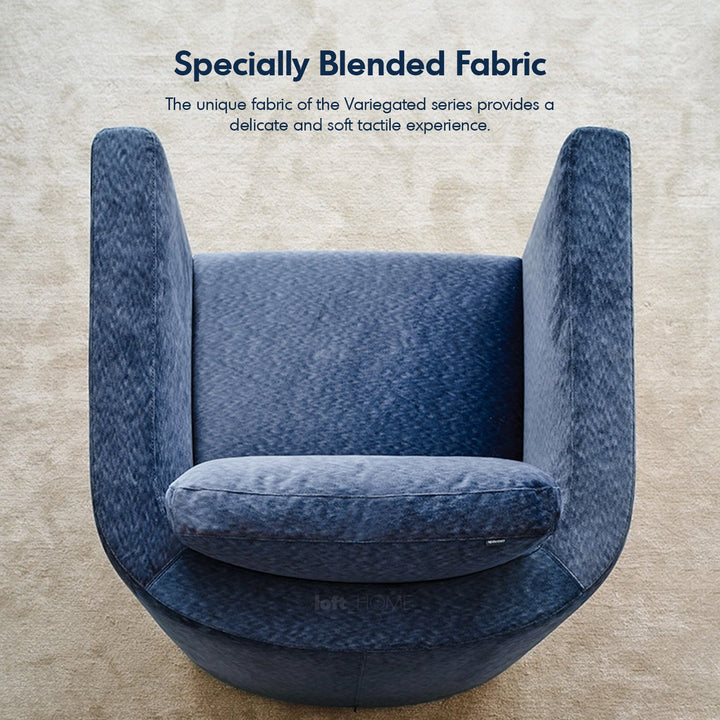 Minimalist fabric 1 seater revolving sofa variegated in still life.