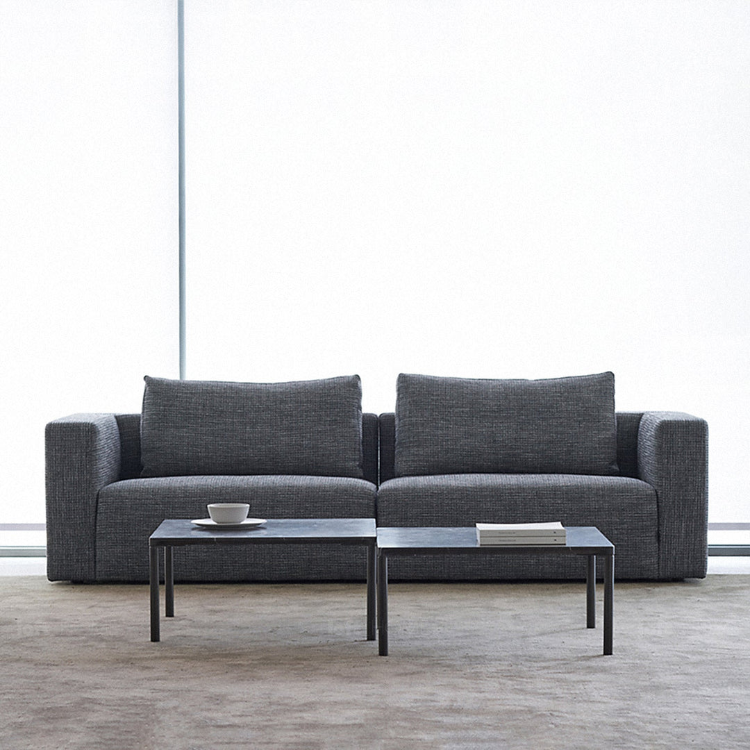 Minimalist fabric 2 seater sofa bri in panoramic view.