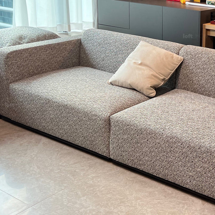 Minimalist fabric 2 seater sofa bri layered structure.