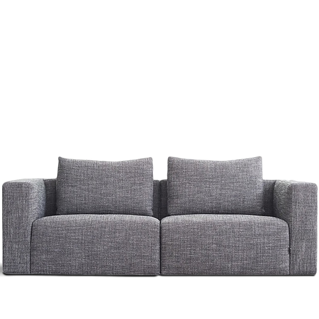 Minimalist fabric 3 seater sofa bri in white background.