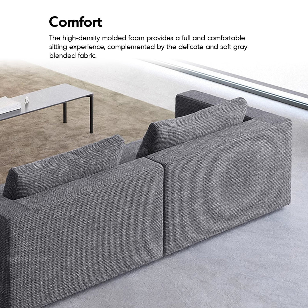 Minimalist fabric 3 seater sofa bri in close up details.