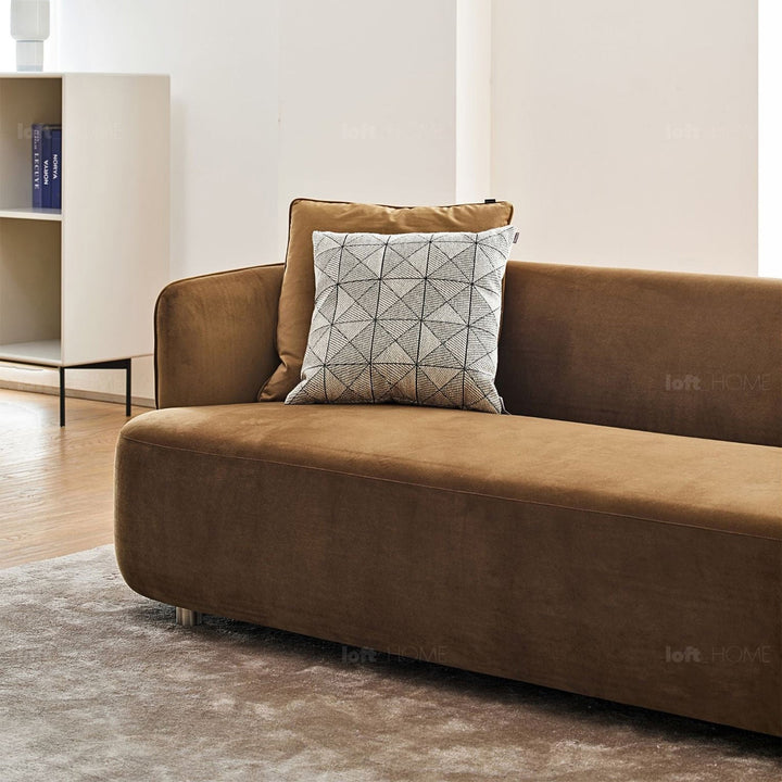 Minimalist fabric 3 seater sofa heb in close up details.