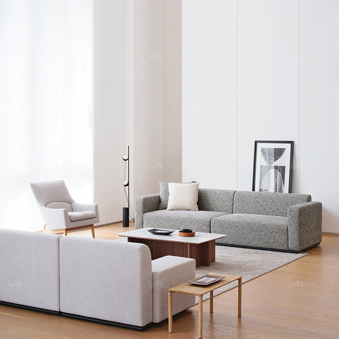 Minimalist fabric 3 seater sofa nemo in still life.