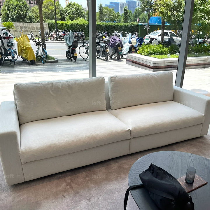 Minimalist fabric 3 seater sofa white in panoramic view.
