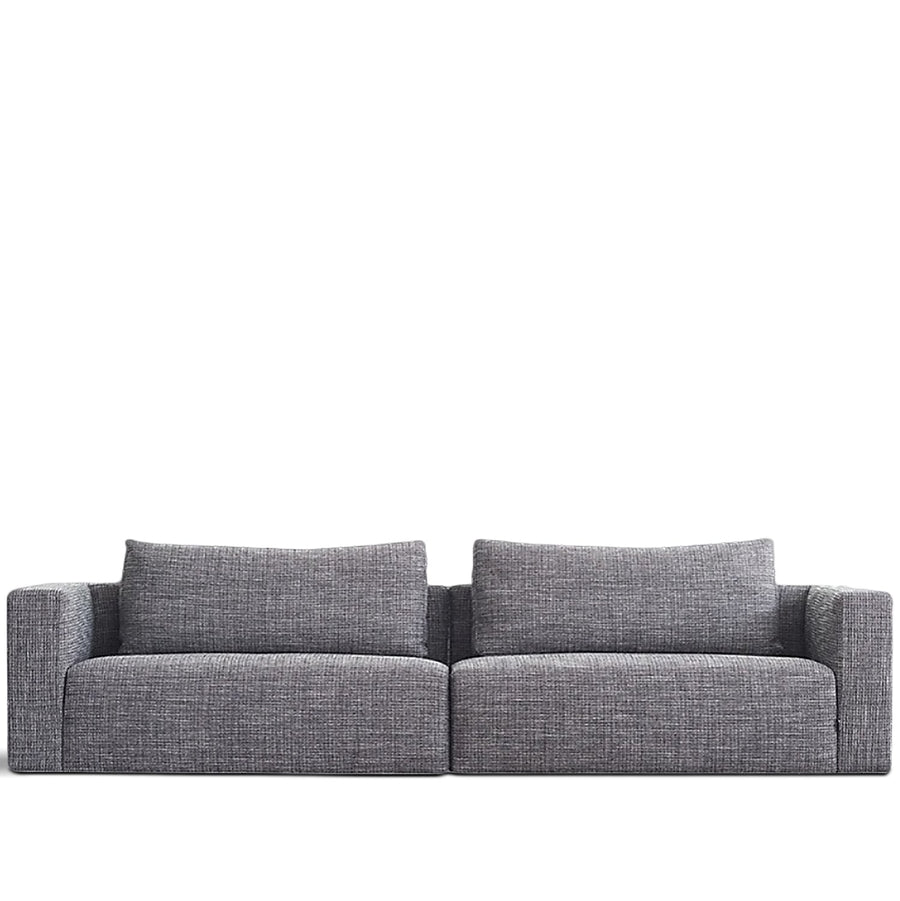 Minimalist fabric 4 seater sofa bri in white background.
