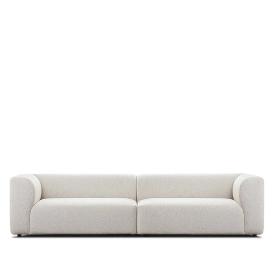 Minimalist fabric 4 seater sofa flower in white background.