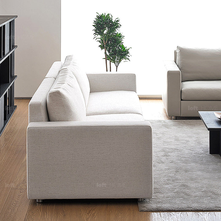 Minimalist fabric 4 seater sofa white in details.