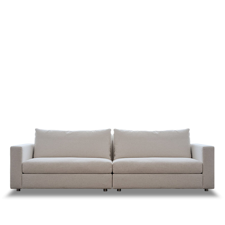 Minimalist fabric 4 seater sofa white in white background.