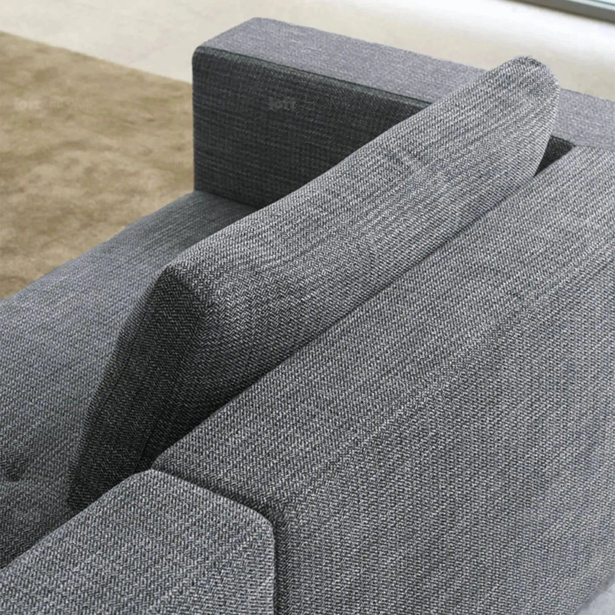 Minimalist fabric 4.5 seater sofa bri in still life.