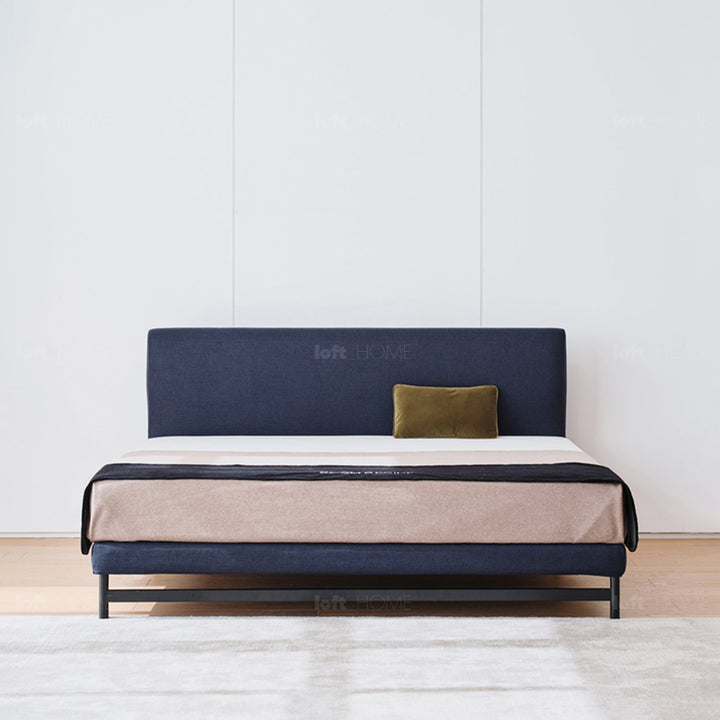 Minimalist fabric bed nor in still life.