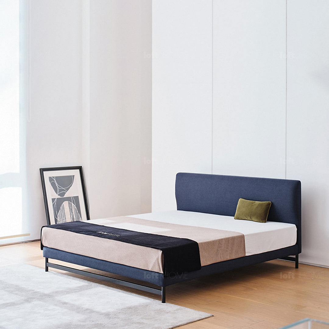 Minimalist fabric bed nor in panoramic view.