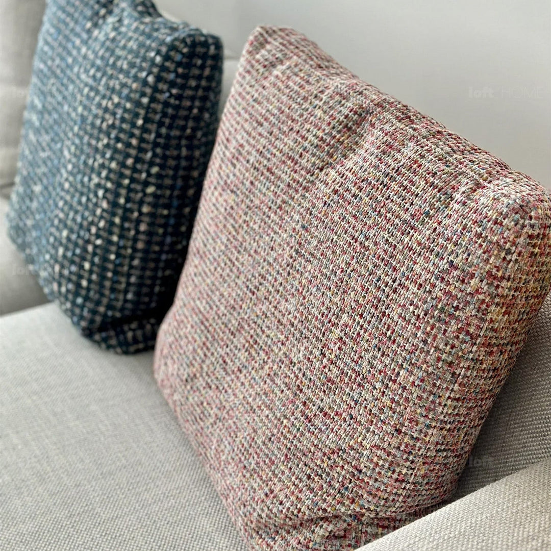 Minimalist fabric sofa pillow autumn pink with context.