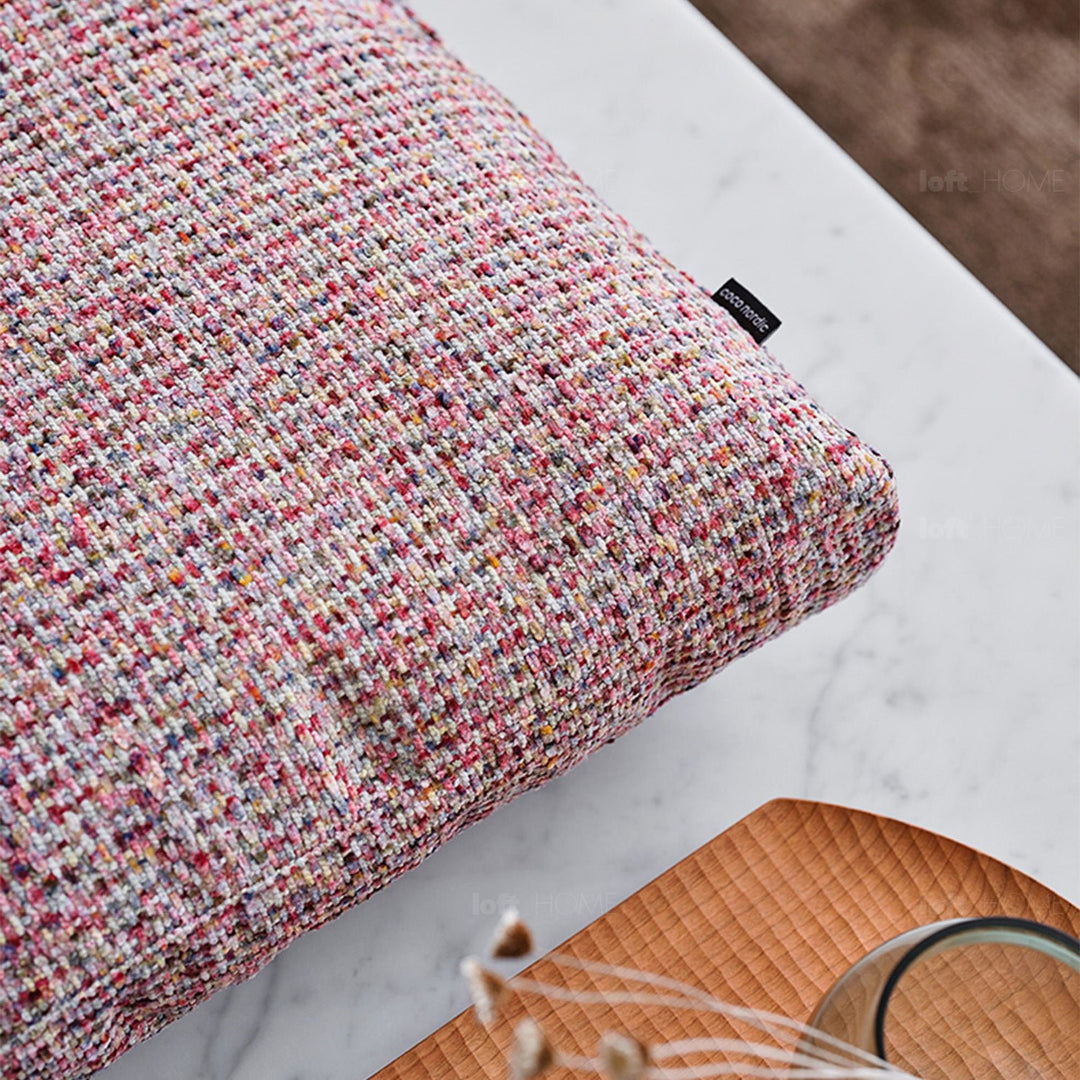 Minimalist fabric sofa pillow autumn pink in still life.