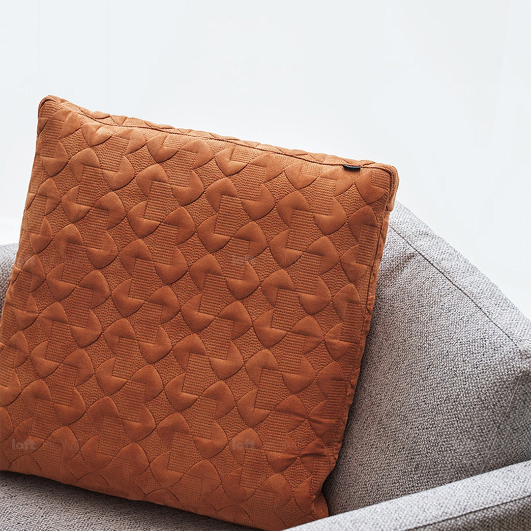 Minimalist fabric sofa pillow classic orange in details.