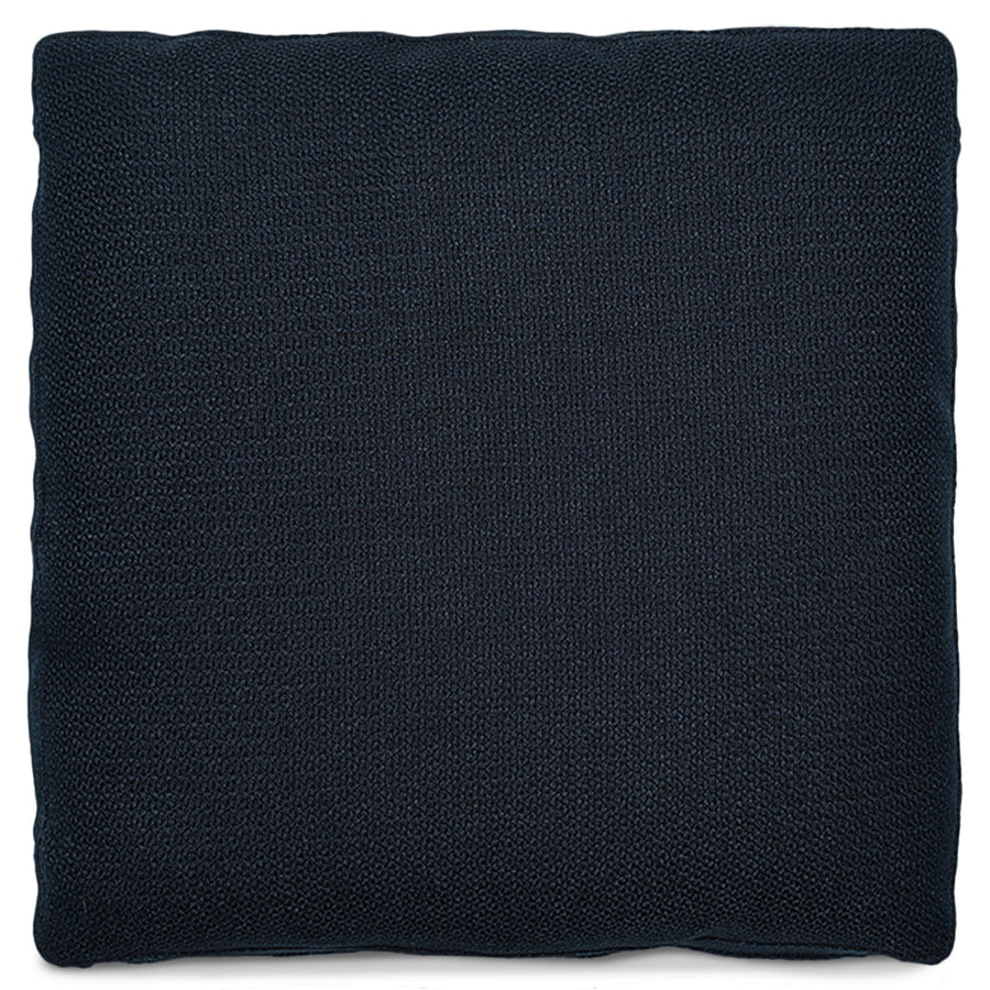 Minimalist fabric sofa pillow indigo blue in white background.