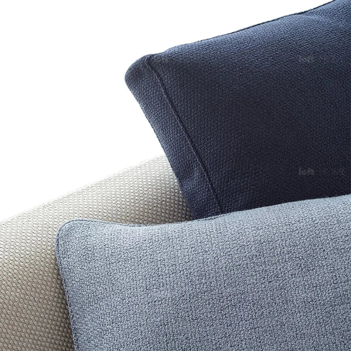 Minimalist fabric sofa pillow indigo blue in real life style.