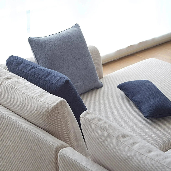 Minimalist fabric sofa pillow indigo blue material variants.