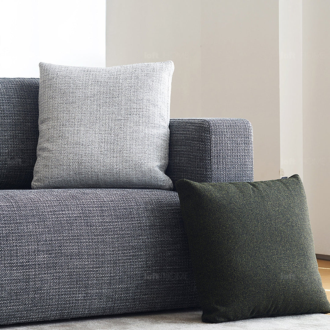 Minimalist fabric sofa pillow nor white material variants.