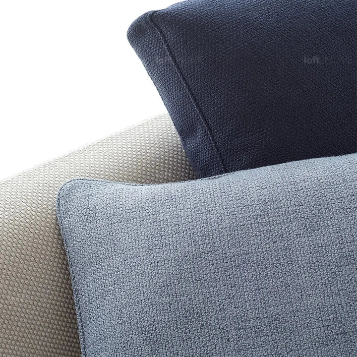 Minimalist fabric sofa pillow pale blue color swatches.