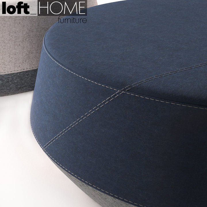 Minimalist fabric stool buono with context.