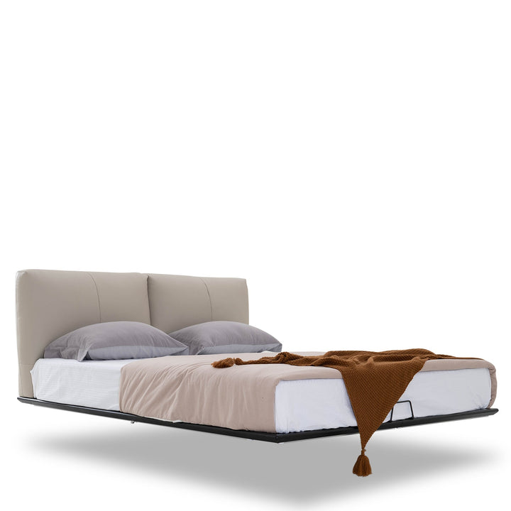 Minimalist genuine leather floating bed fides in white background.