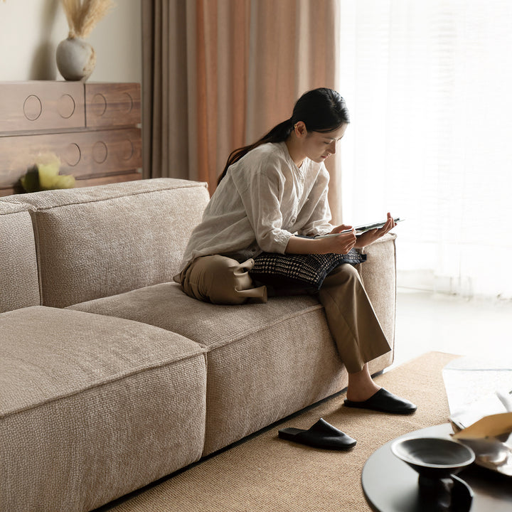 Minimalist linen fabric 4 seater sofa camaleonda in real life style.