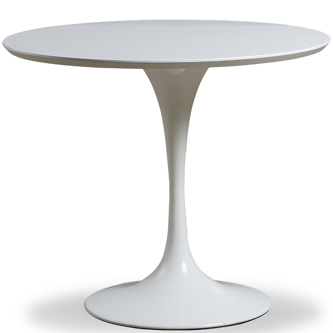 Minimalist plywood round dining table tulip in white background.