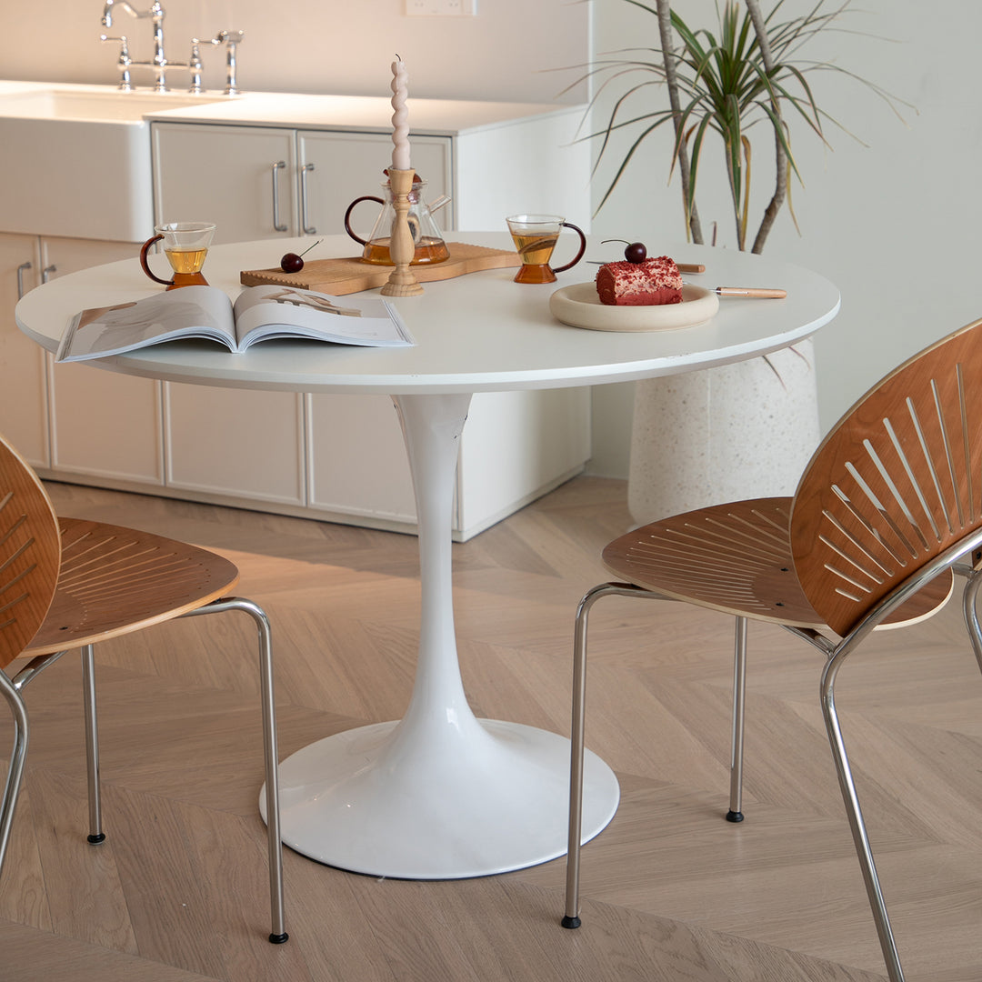 Minimalist plywood round dining table tulip material variants.
