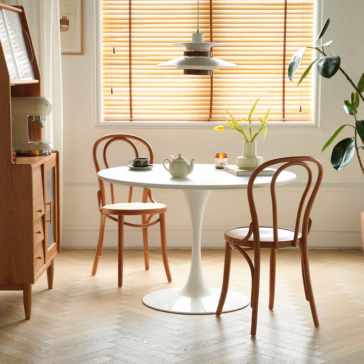 Minimalist plywood round dining table tulip in real life style.