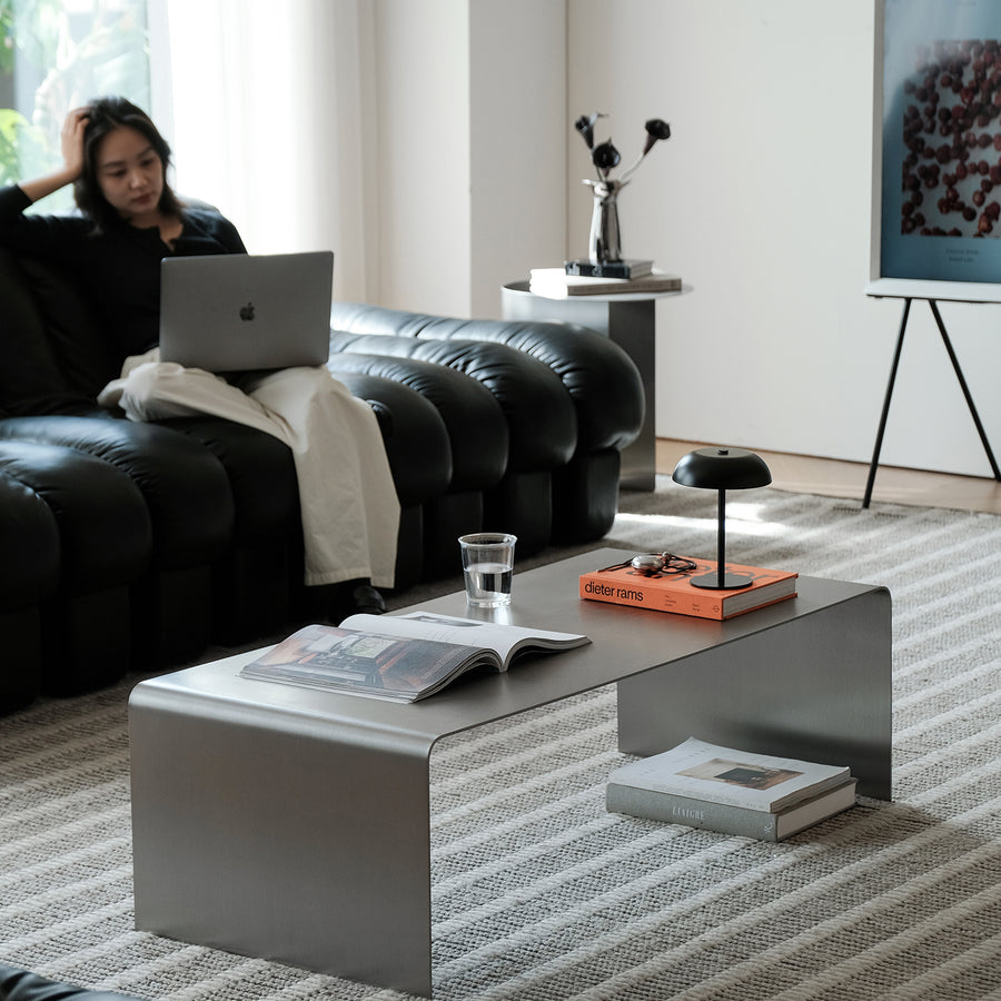 Minimalist steel coffee table arc primary product view.