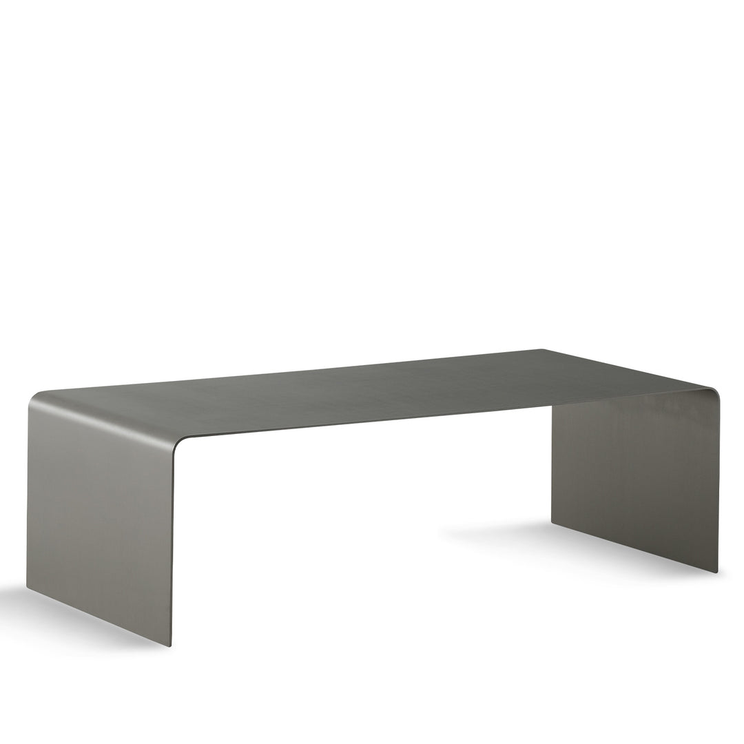 Minimalist steel coffee table arc in white background.