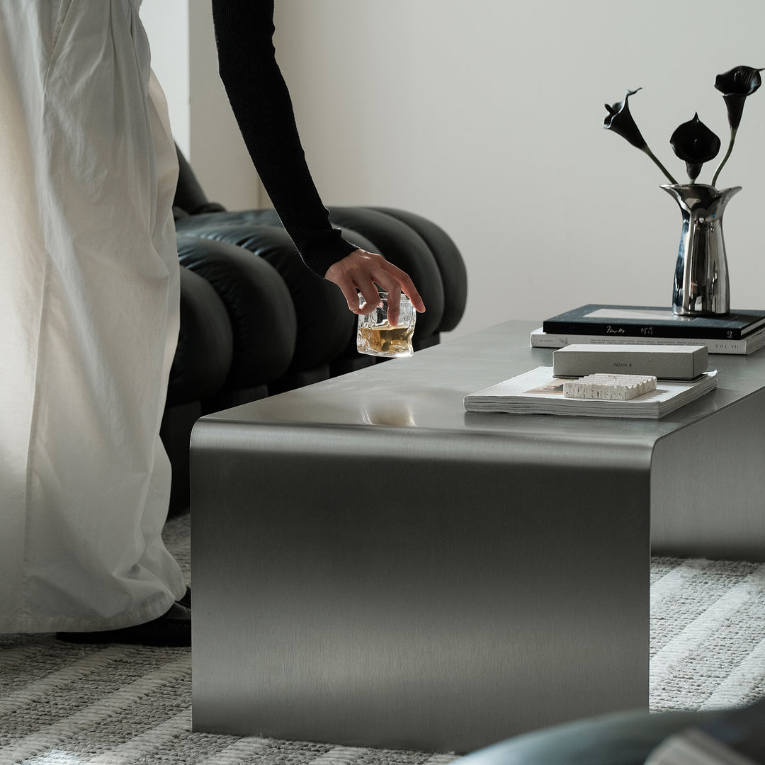 Minimalist steel coffee table arc in real life style.