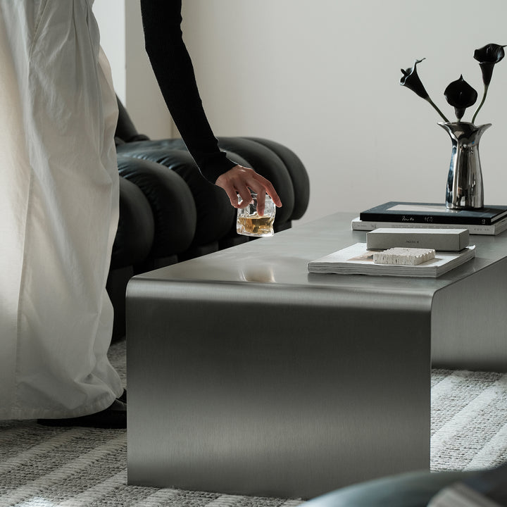 Minimalist steel coffee table arc in real life style.