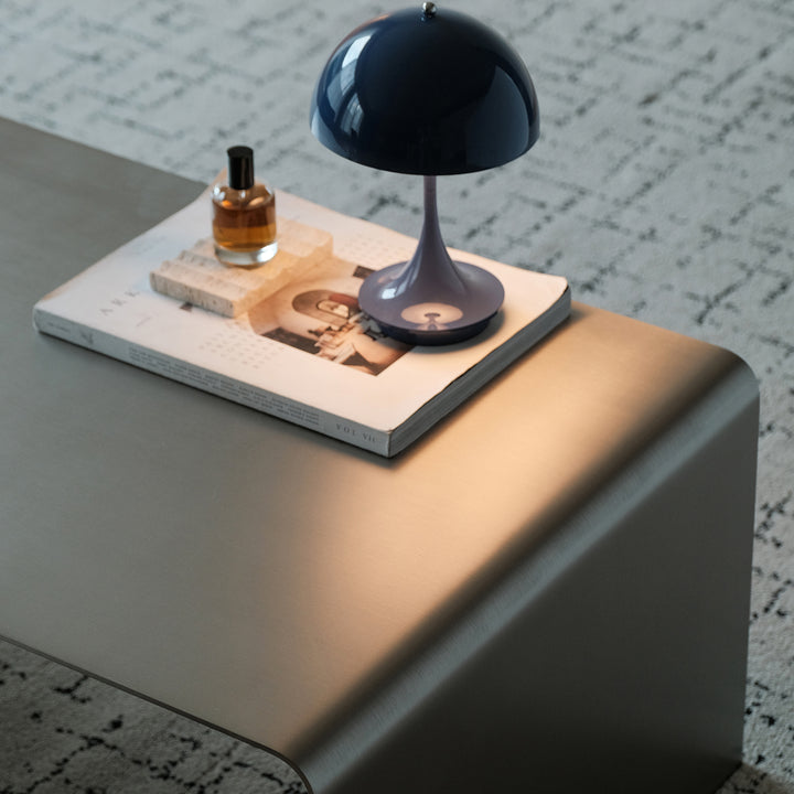 Minimalist steel coffee table arc in details.