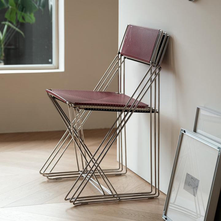 Minimalist steel dining chair x-line conceptual design.
