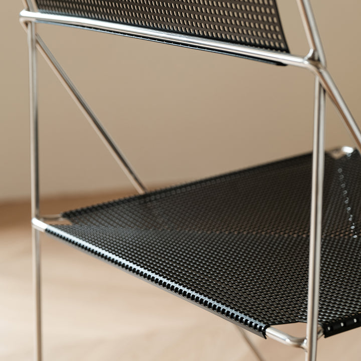 Minimalist steel dining chair x-line material variants.