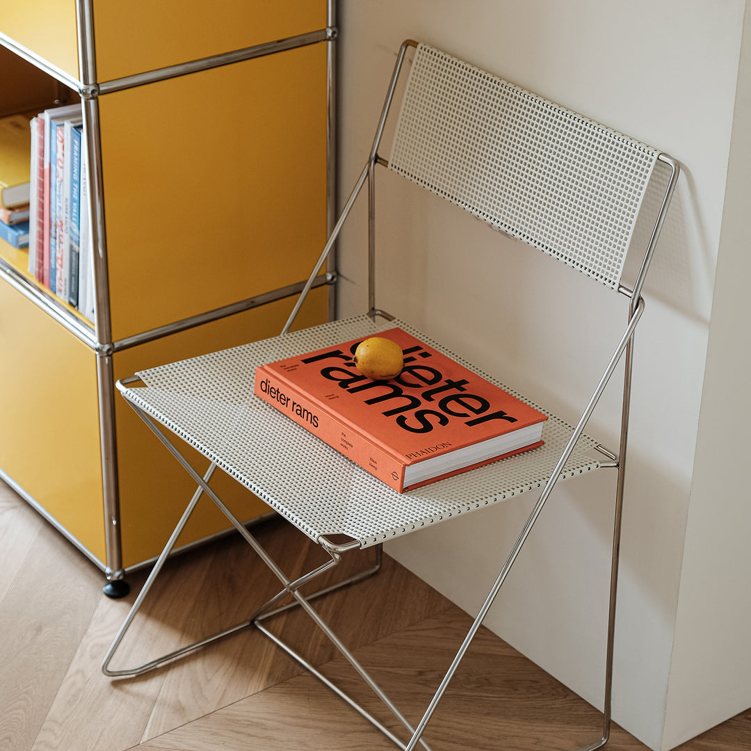 Minimalist steel dining chair x-line in real life style.