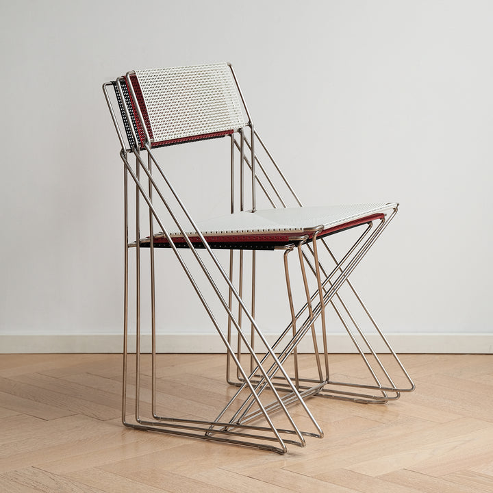 Minimalist steel dining chair x-line in details.