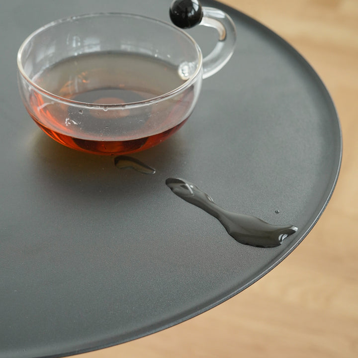 Minimalist steel marble side table loop in close up details.