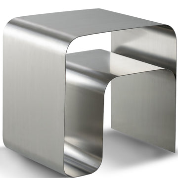 Minimalist steel side table arc in white background.