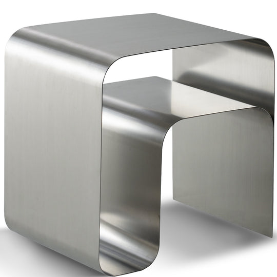 Minimalist steel side table arc in white background.