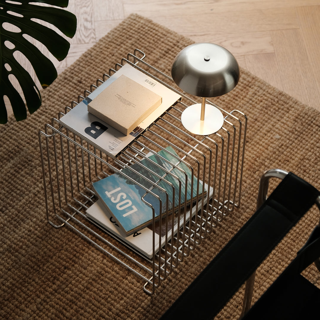 Minimalist steel side table panton wire in panoramic view.