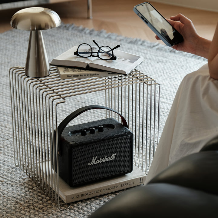 Minimalist steel side table panton wire in real life style.