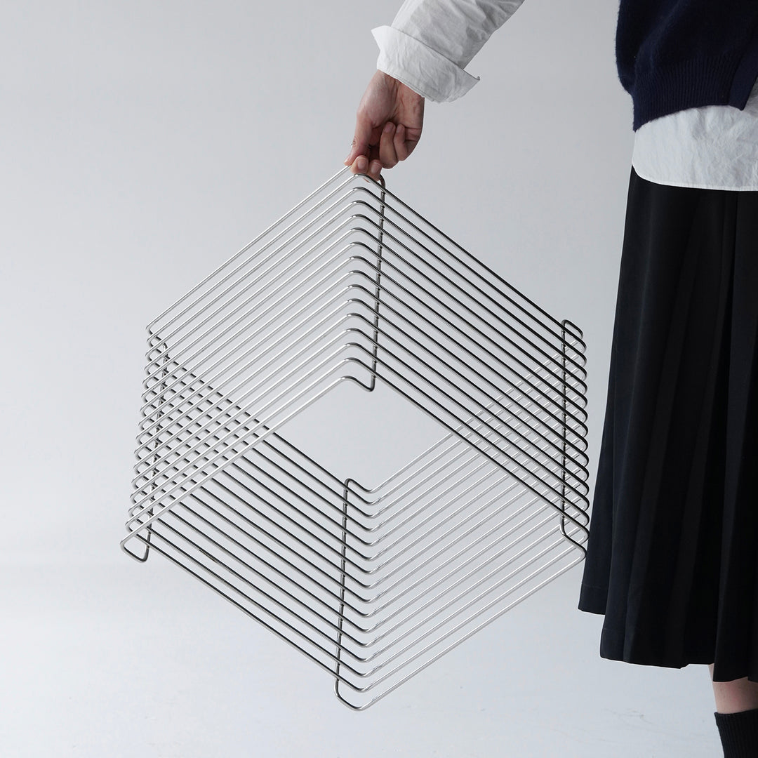 Minimalist steel side table panton wire in details.