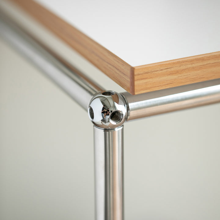 Minimalist steel wheeled study table usm with context.